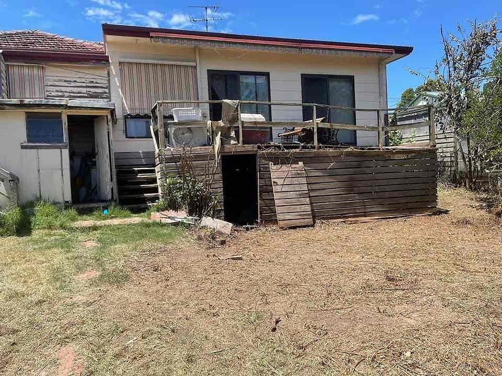 AFTER - Back porch and backyard cleared of blackberry and ready for renovations and gardening.